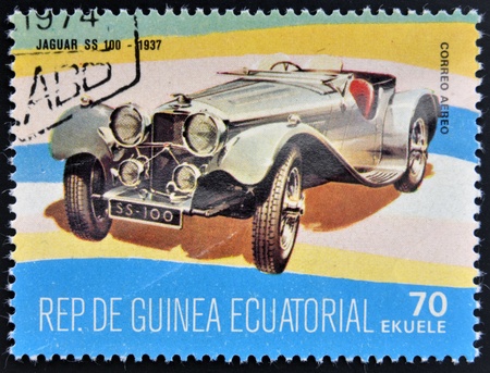 EQUATORIAL GUINEA - CIRCA 1974: A stamp printed in Guinea dedicated to vintage cars, shows Jaguar SS 100, 1937, circa 1974のeditorial素材