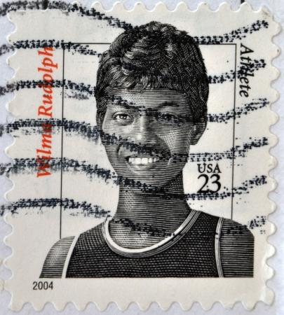 UNITED STATES OF AMERICA - CIRCA 2004: A stamp printed in USA shows image of Wilma Rudolph, circa 2004 のeditorial素材