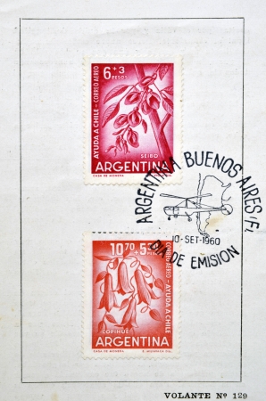 ARGENTINA - CIRCA 1960: Stamps printed in Argentina dedicated to helping Chile shows kapok flower, Erythrina Cristagalli, and Lapageria, Chilean bellflower or copihue, circa 1960   のeditorial素材
