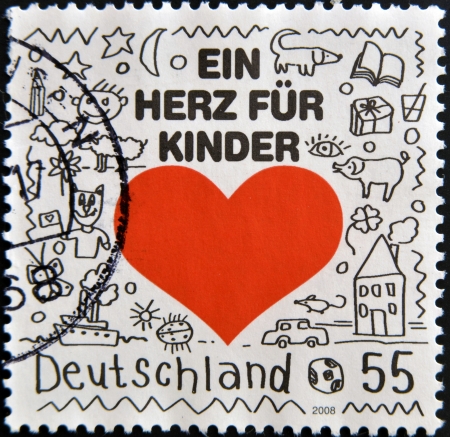 GERMANY - CIRCA 2008: A stamp printed in Germany shows a heart for children, circa 2008の写真素材