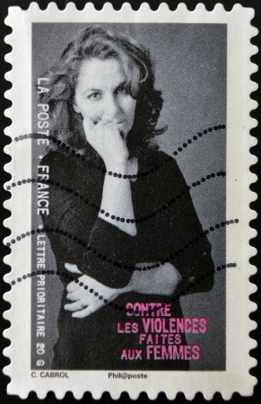 FRANCE - CIRCA 2010: A stamp printed in France dedicated to combating violence against women, circa 2010のeditorial素材