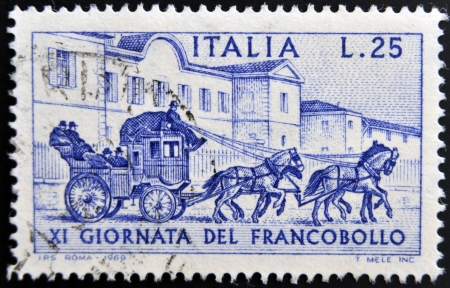 ITALY - CIRCA 1969: a stamp printed in  Italy shows Sondrio-Tirano Stagecoach, 1903, circa 1969 の写真素材