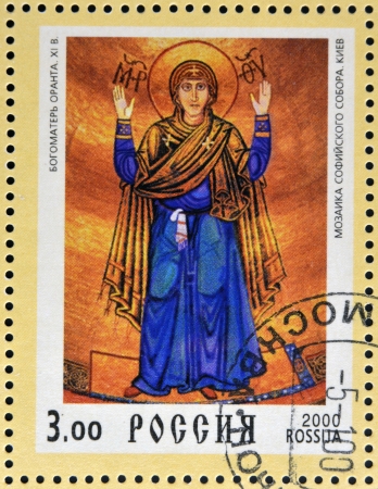 RUSSIA - 2000: Stamp printed in Russia dedicated to Christianity 2000 years, shows Our Lady Oranta mosaic, circa 2000の写真素材