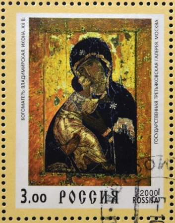 RUSSIA - 2000: Stamp printed in Russia dedicated to Christianity 2000 years, shows Our Lady Vladimirskaya icon, circa 2000の写真素材