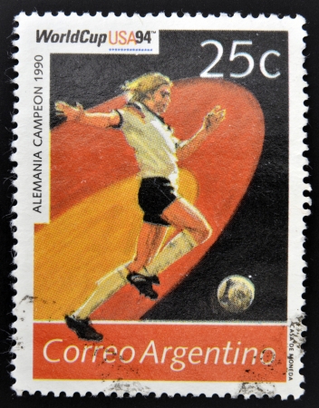 ARGENTINA - CIRCA 1994: Stamp printed in Argentina dedicated to the football world cup USA 1994, shows the world champion Germany, 1990, circa 1994 のeditorial素材