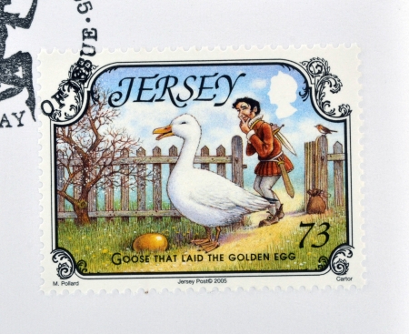 JERSEY - CIRCA 2005: A stamp printed in Jersey shows Goose that laid the golden egg, circa 2005のeditorial素材