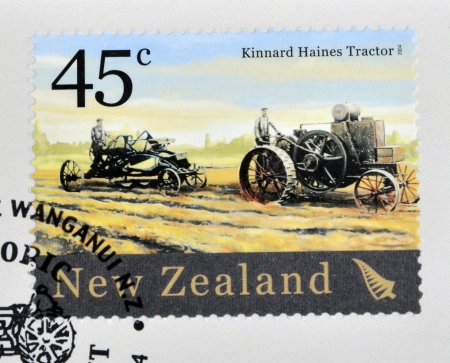 NEW ZEALAND - CIRCA 2004  A stamp printed in New Zealand dedicated to historic farm equipment, shows Kinnard Haines Tractor, circa 2004のeditorial素材