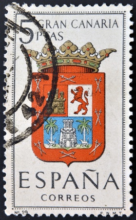 SPAIN - CIRCA 1965: A stamp printed in Spain dedicated to Arms of Provincial Capitals shows Gran Canaria, circa 1965. のeditorial素材