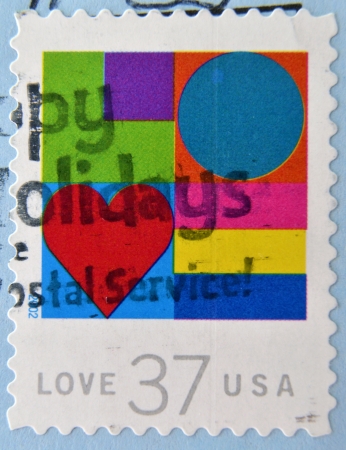 UNITED STATES OF AMERICA- CIRCA 2002: A stamp printed in USA shows hearts, love, circa 2002 のeditorial素材
