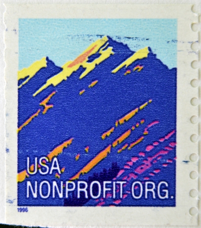 UNITED STATES OF AMERICA - CIRCA 1995: A stamp printed in USA shows mountain, circa 1995のeditorial素材