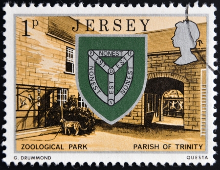 JERSEY - CIRCA 1976: a stamp printed in Jersey shows Arms of Trinity and Zoo, circa 1976 のeditorial素材