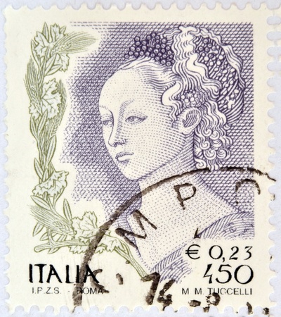 ITALY - CIRCA 2002: A stamp printed in Italy shows detail of Mary Magdalene in "The Feast of Herod and Salome's dance" designed by Filippo Lippi, circa 2002 のeditorial素材