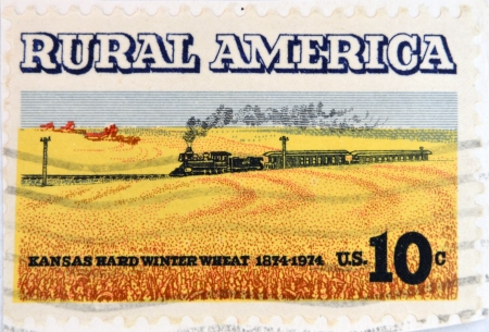 UNITED STATES OF AMERICA - CIRCA 1974: A Stamp printed in USA shows the Wheat Fields and Train, Rural America issue, circa 1974 のeditorial素材