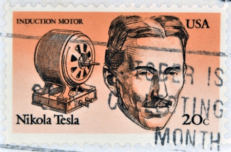 UNITED STATES OF AMERICA - CIRCA 1983: A stamp printed in USA shows Induction motor and portrait of...