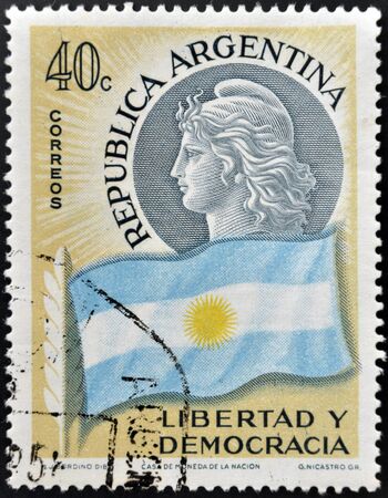 ARGENTINA - CIRCA 1958  A stamp printed in Argentina shows flag and woman, freedom and democracy, circa 1958のeditorial素材