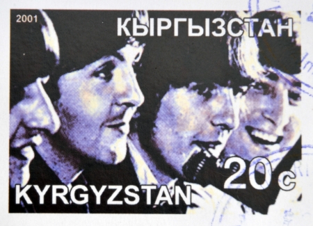 KIRZIGUISTAN - CIRCA 2001:  stamp printed in Kirziguistan shows the Beatles, circa 2001 のeditorial素材