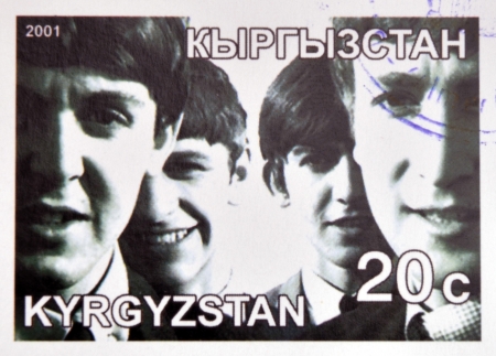 KIRZIGUISTAN - CIRCA 2001:  stamp printed in Kirziguistan shows the Beatles, circa 2001 のeditorial素材
