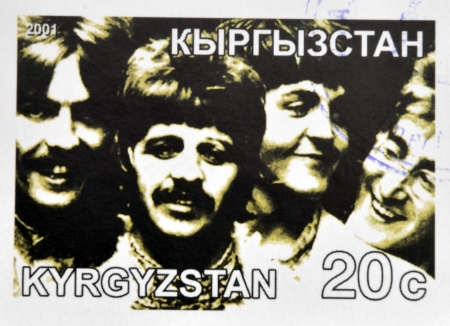 KIRZIGUISTAN - CIRCA 2001:  stamp printed in Kirziguistan shows the Beatles, circa 2001 のeditorial素材