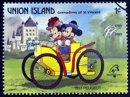 ST. VINCENT GRENADINES - UNION ISLAND - CIRCA 1989: A stamp printed in St. Vincent shows Mickey Mouse and Minnie Mouse, 1893 Peugeot, circa 1989 のeditorial素材