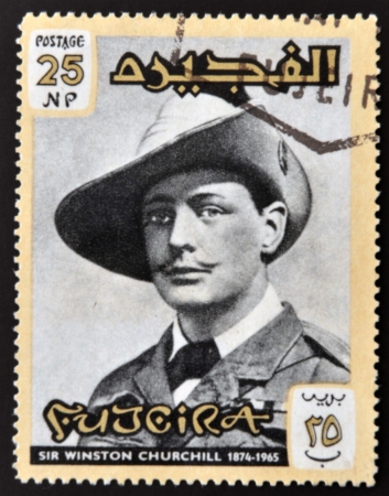 FUJERIA - CIRCA 1966: A stamp printed in Fujeira shows image of sir winston churchil, 1874-1965, circa 1966 のeditorial素材