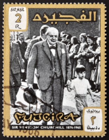 FUJERIA - CIRCA 1966: A stamp printed in Fujeira shows image of sir winston churchil, 1874-1965, circa 1966 のeditorial素材