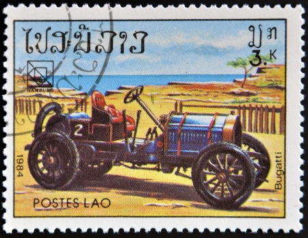 LAOS - CIRCA 1984: A stamp printed in Laos shows retro car,  Bugatti, circa 1984. のeditorial素材