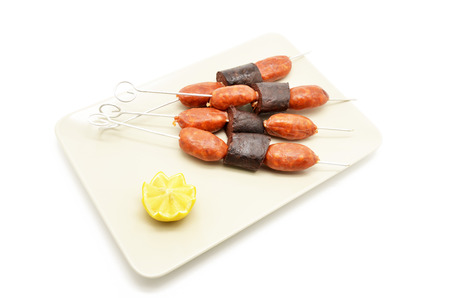 pincho of sausage and blood sausage (chorizo y morcilla)の写真素材
