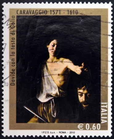 ITALY - CIRCA 2010: A stamp printed in Italy shows David with the Head of Goliath by Caravaggio, circa 2010 のeditorial素材