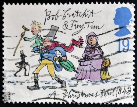 UNITED KINGDOM - CIRCA 1993: A stamp printed in Great Britain dedicated to Christmas shows Bob Cratchit and Tiny Tim, circa 1993の写真素材