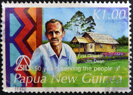 PAPUA NEW GUINEA - CIRCA 2006: A stamp pritned in Papua shows Canadian Dr. Jim Dean served as the first director of the SIL Papua New Guinea Branch, circa 2006のeditorial素材
