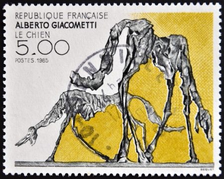 FRANCE - CIRCA 1985: a stamp printed in France shows The Dog, Abstract by Alberto Giacometti, circa 1985 のeditorial素材