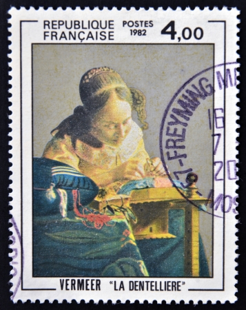 FRANCE - CIRCA 1982: a stamp printed in France shows The Lacemaker, Painting by Vermeer, circa 1982 のeditorial素材