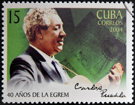CUBA - CIRCA 2004: A stamp printed in cuba shows Carlos Puebla, circa 2004のeditorial素材