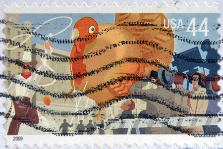 UNITED STATES OF AMERICA - CIRCA 2009: A stamp printed in USA dedicated to Thanksgiving Day Parade, shows Cowboy and Turkey, circa 2009 のeditorial素材