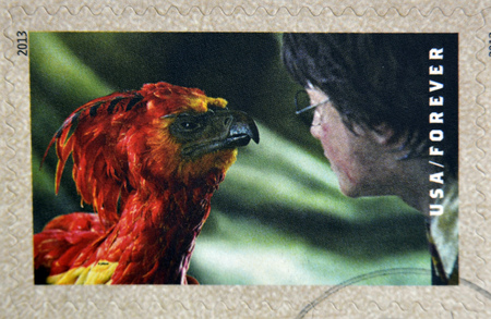 UNITED STATES OF AMERICA - CIRCA 2013: A stamp printed in USA dedicated to Harry Potter shows Harry Potter and Fawkes the Phoenix, circa 2013のeditorial素材