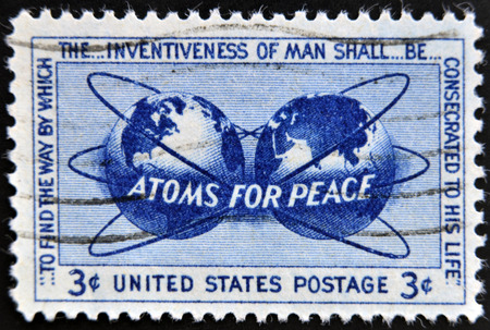 UNITED STATES OF AMERICA - CIRCA 1955: a stamp printed in USA shows Atomic Energy Encircling the...