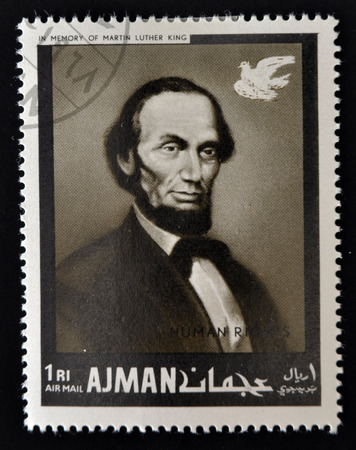 AJMAN - CIRCA 1974: Stamp printed in Ajman in memory of Martin Luther King, Human Rights, shows Lincoln, circa 1974 のeditorial素材