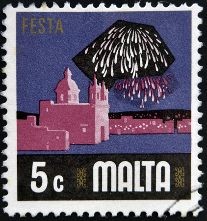 MALTA - CIRCA 1973: A stamp printed in Malta shows fireworks over the harbor of Valletta, circa 1973の写真素材