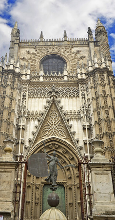 Statuette in front of the main entrance to the Cathedral, Sevilleの写真素材