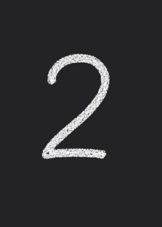 2 written on a black blackboardの写真素材