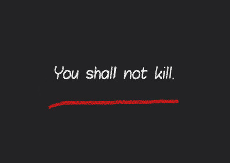 You shall not kill written on a blackboardの写真素材