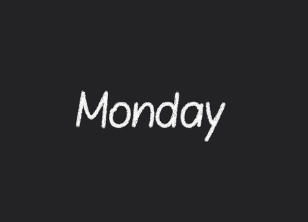 Monday written on a blackboardの写真素材