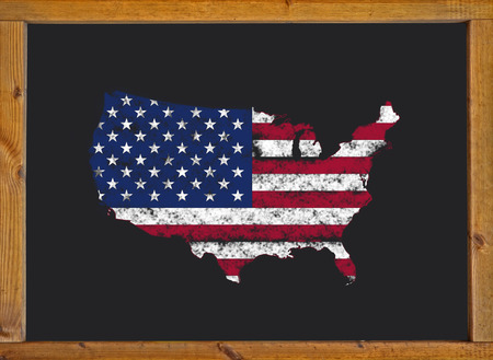 United States flag over the map on a blackboardの写真素材
