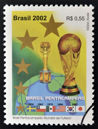 BRAZIL - CIRCA 2002: a stamp printed in Brazil showing an image of the World Cup trophy and the years that Brazil won the World Cup, circa 2002.のeditorial素材