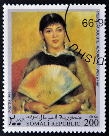 REPUBLIC SOMALI - CIRCA 1999: A stamp printed in Somalia shows Girl with a fan by Renoir, circa 1999の写真素材
