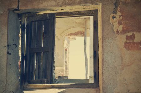 window of an abandoned houseの写真素材