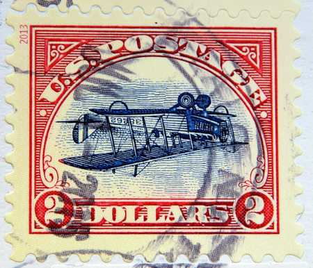 UNITED STATES OF AMERICA - CIRCA 2013: A stamp printed in USA shows Inverted Curtis Jenny Biplane, circa 2013のeditorial素材