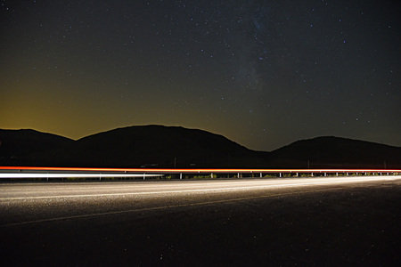 Car trails in the starry nightの写真素材