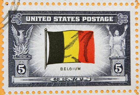 UNITED STATES OF AMERICA - CIRCA 1943: A stamp printed in USA shows flag of Belgium, circa 1943のeditorial素材