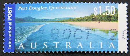 GRANADA, SPAIN - DICIEMBRE 16, 2015: A stamp printed in Australia shows Port Douglas, Queensland, 2001のeditorial素材